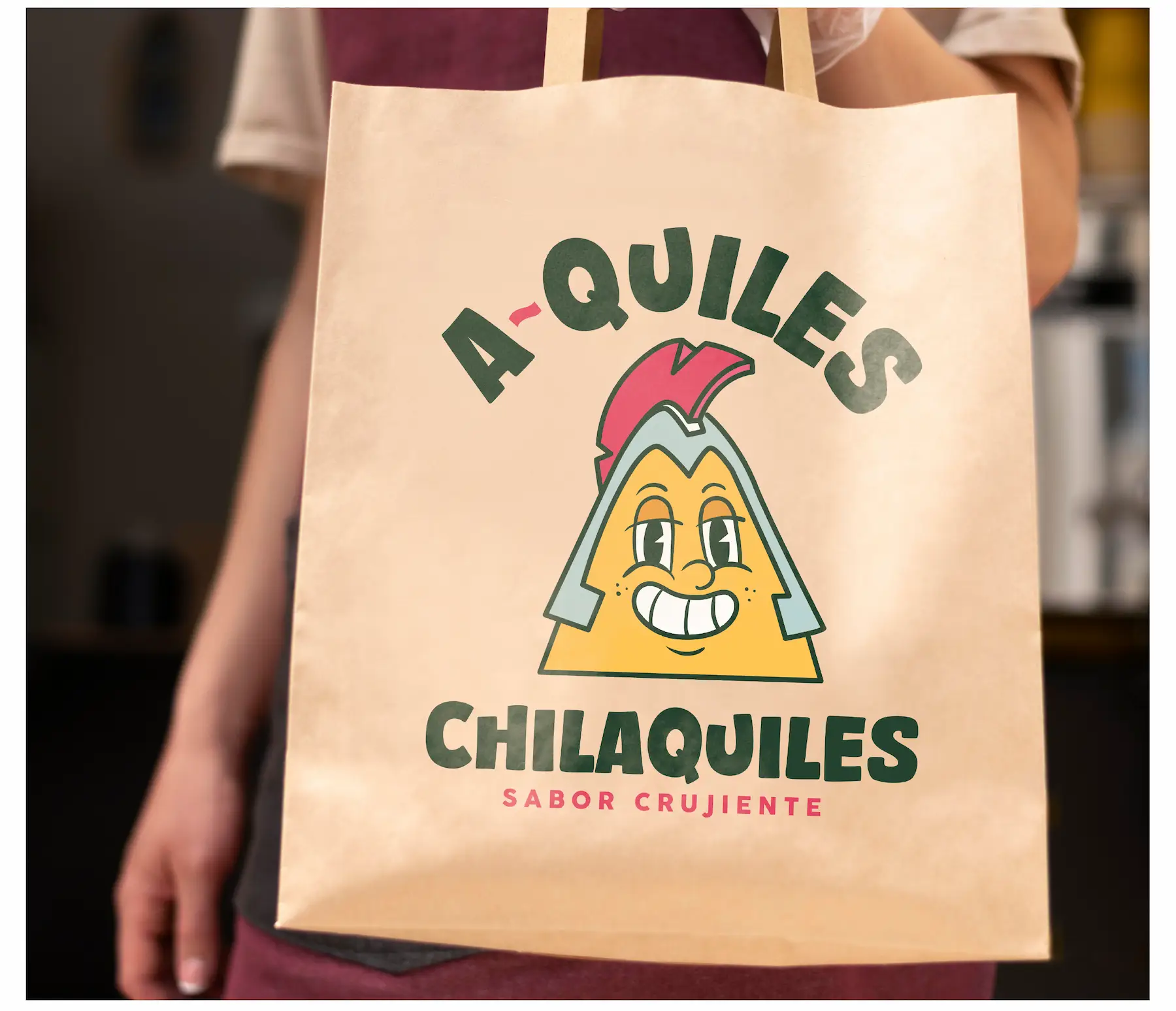 Logotipo de A-quiles Chilaquiles en bolsa de tela